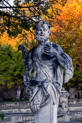 Obraz premium Statue of Pan, Gardens of the Fountain (Jardins de la fontaine) in autumn, Nîmes, France