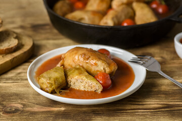 stuffed cabbage, rice and minced meat with tomato sauce
