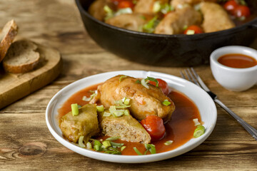 stuffed cabbage, rice and minced meat with tomato sauce