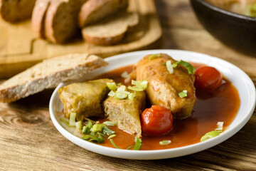 stuffed cabbage, rice and minced meat with tomato sauce