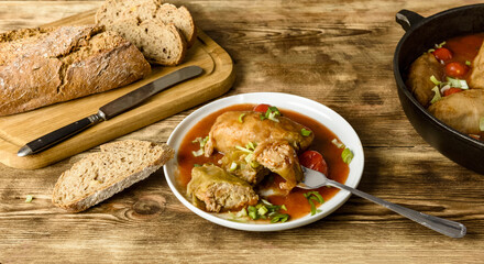 stuffed cabbage, rice and minced meat with tomato sauce