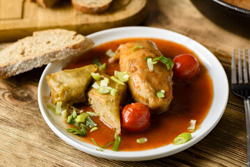 stuffed cabbage, rice and minced meat with tomato sauce