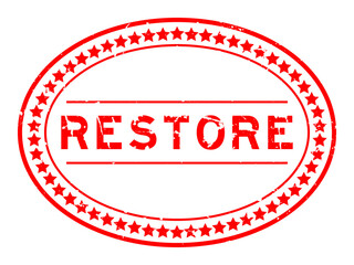 Grunge red restore word oval rubber seal stamp on white background