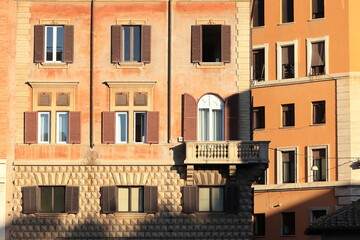 Fototapeta na wymiar Rome Largo Argentina Street View with Orange-Brown Building Facades, Italy