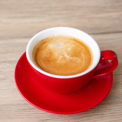 Hot espresso coffee on table, Red coffee cup in cafe or home.Top view with blank copy space for your text.