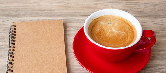 blank notebook and coffee cup on wood table. Motivation, Resolution, To do list, Strategy and Plan concept