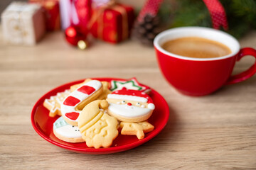 Merry Christmas with homemade cookies and coffee cup on wood table background. Xmas eve, party, holiday and happy New Year concept