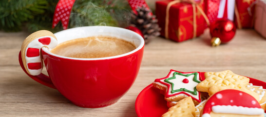 Merry Christmas with homemade cookies and coffee cup on wood table background. Xmas eve, party, holiday and happy New Year concept