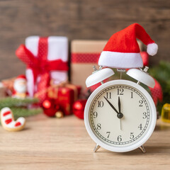 Merry Christmas with Vintage alarm clock and Xmas decoration on wooden table. party, holiday and boxing day concept