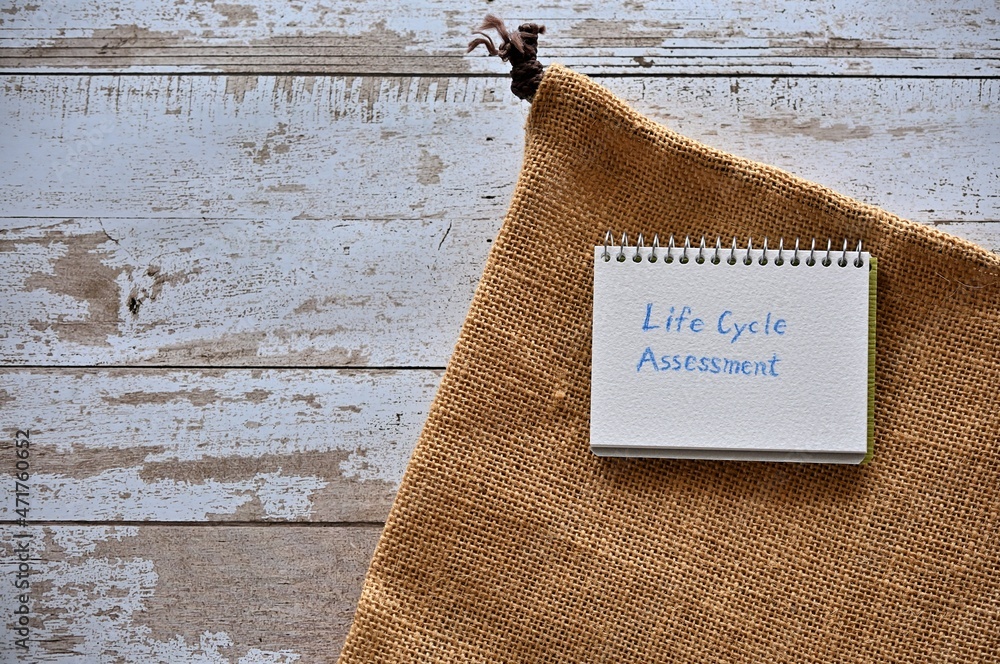 Poster there is a small scetchbook with the word life cycle assessment with hemp cloth.
