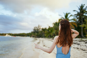 Fototapeta na wymiar woman in blue swimsuit on the beach island lifestyle