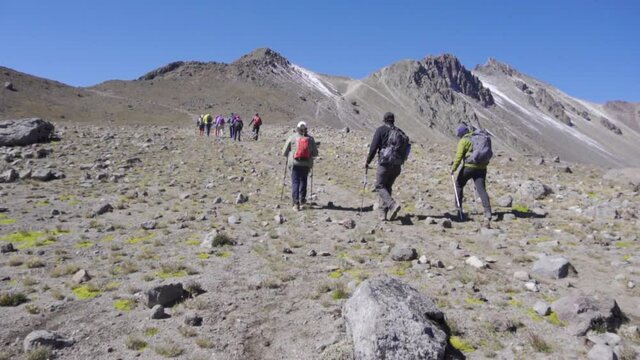 hikers walking to the summit of the nevado de toluca volcano