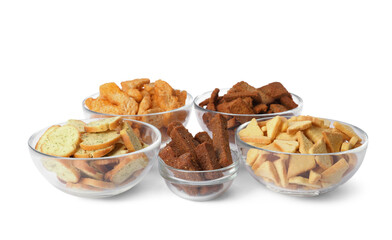 Different crispy rusks in bowls on white background