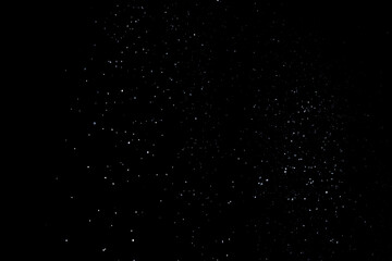 snow overlay photo on black. abstract snow texture to give a winter season effect. realistic effect of the heavy snowfall.