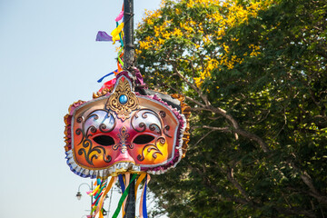 Vibrant colored and unique shaped masks displayed along the city streets in Panaji city during Goa Carnaval in Goa, India.  - obrazy, fototapety, plakaty