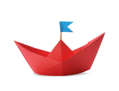 Handmade red paper boat with flag isolated on white. Origami art
