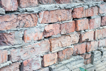 Old brick wall of a village house.