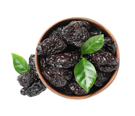 Bowl with sweet dried prunes and green leaves on white background, top view