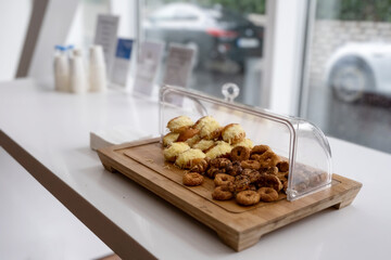 Food standing on the table in the car dealership showroom