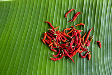 High angle view of red dried chili, on a fresh banana leaf, use for advertising, background, or other concepts