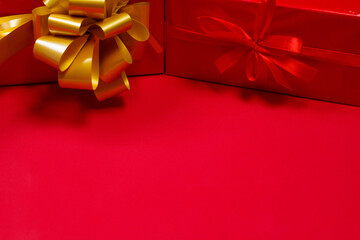 Bright christmas gifts on red background. Merry christmas and happy new year concept. Space for text.