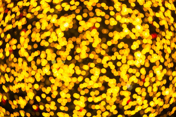 Gold yellow bokeh background happy new year 2022. abstract effect light night out of focus circle wallpaper. for christmas party celebration holidays or technology background concept.