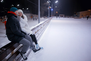 couple on ice rink evening, lovers christmas sport winter holidays