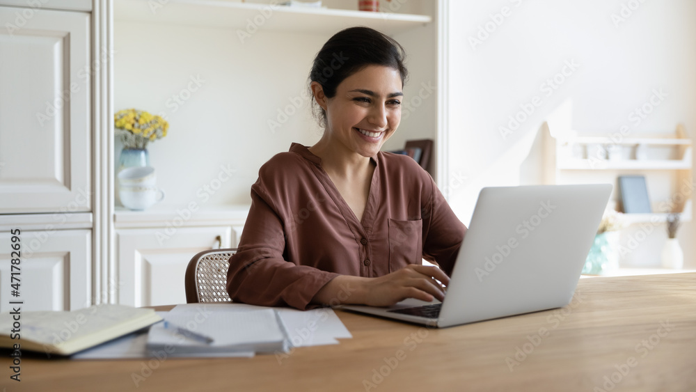 Canvas Prints happy millennial indian businesswoman working on computer in modern home office, checking email, com