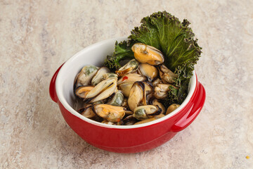 Tasty marinated mussels in the bowl