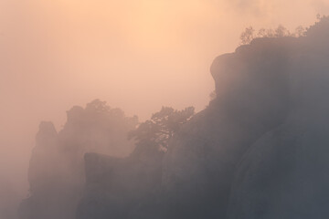 Foggy sunset in the mountains. Beautiful autumn landscape. Demerdji national reserve, Crimea.