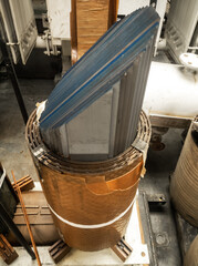 Fototapeta na wymiar closeup shot of laminated transformer core with sheet type windings