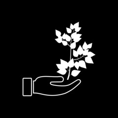 Hand carrying plant icon isolated on dark background