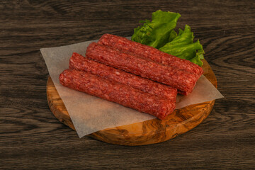 Raw beef sausages with spices
