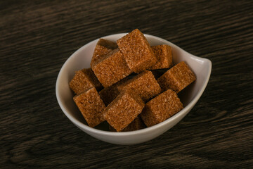 Cane sugar cubs in the bowl