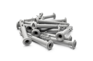 Heap of plastic grey dowels on white. Close up.