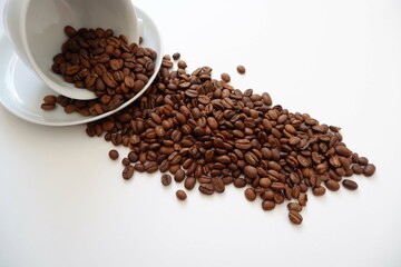 Coffee beans, White Cup and saucer on white background. coffee, Cafe, shop design elements. 