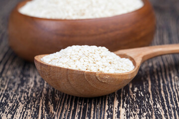 white sesame seeds on a wooden table