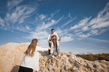 Dad and daughter on the background of clouds 3317.