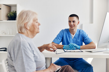 Fototapeta premium elderly woman at the doctor health treatment