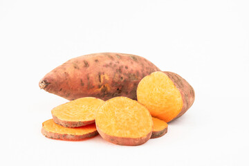 Close-up of whole and sliced sweet potatoes