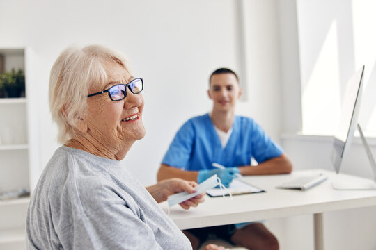 elderly patient talking to the doctor in the medical office