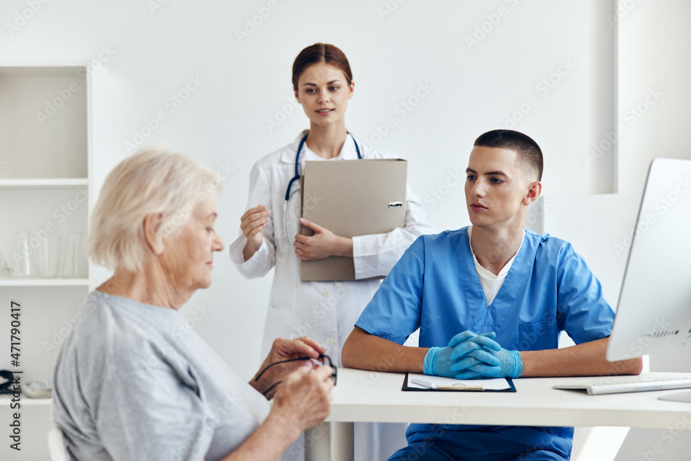 Wall mural old woman hospital examination in the medical office