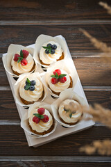 Cardboard stand with cream cakes and berries 3625.