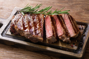 Sliced grilled meat steak with rosemary
