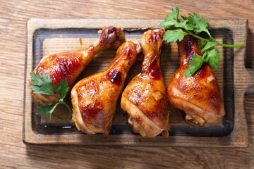 Grilled chicken legs with parsley, top view