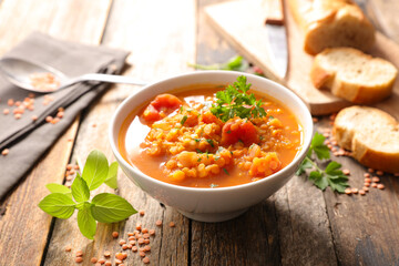 bowl of lentils soup with herb