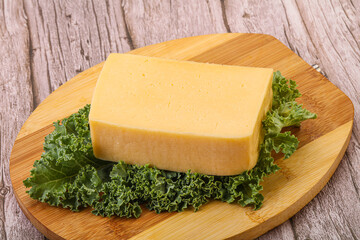 Tasty yelloow Tilsiter cheese brick