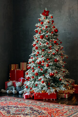 Christmas tree and gift boxes near the window. High quality photo