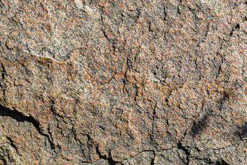 Cracked granite stone texture. Granite rock surface. Natural stone backdrop