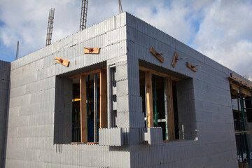 Construction of a passive house from durable and warm polystyrene blocks - obrazy, fototapety, plakaty